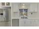 Modern kitchen with stainless steel appliances and view of the pool at 2708 Bigelow Dr, Sarasota, FL 34239