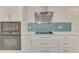 Modern kitchen featuring white cabinets and stainless steel appliances at 2708 Bigelow Dr, Sarasota, FL 34239