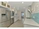 Updated kitchen, stainless steel appliances and white cabinets at 2708 Bigelow Dr, Sarasota, FL 34239