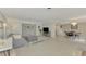 Open living space with a sectional sofa, dining table, and kitchen views at 2708 Bigelow Dr, Sarasota, FL 34239