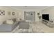 Open concept living room with sectional sofa, ottoman, and TV at 2708 Bigelow Dr, Sarasota, FL 34239
