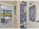 Small powder room with patterned wallpaper and view of the pool at 2708 Bigelow Dr, Sarasota, FL 34239