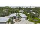 Aerial view of the house, driveway and surrounding landscape at 3011 Ashton Rd, Sarasota, FL 34231