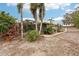 Backyard with screened-in patio and tropical landscaping at 3011 Ashton Rd, Sarasota, FL 34231