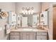 Bright bathroom with single vanity and a large mirror at 3011 Ashton Rd, Sarasota, FL 34231