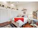 Charming bedroom with white bed frame and built-in shelves at 3011 Ashton Rd, Sarasota, FL 34231