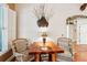 Cozy breakfast nook with rustic wood table and wicker chairs at 3011 Ashton Rd, Sarasota, FL 34231
