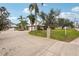 House exterior showcasing a large driveway, landscaping, and two-car garage at 3011 Ashton Rd, Sarasota, FL 34231