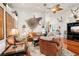 Living room with hardwood floors, leather sofas, and a large zebra print on the wall at 3011 Ashton Rd, Sarasota, FL 34231