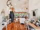 Spacious living room with hardwood floors, a cozy seating area, and large windows at 3011 Ashton Rd, Sarasota, FL 34231