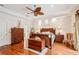 Spacious main bedroom with hardwood floors, large bed, and ample storage at 3011 Ashton Rd, Sarasota, FL 34231