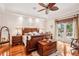 Spacious main bedroom with king-size bed and access to a private patio at 3011 Ashton Rd, Sarasota, FL 34231