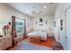 Bright main bedroom with king-size bed and hardwood floors at 3011 Ashton Rd, Sarasota, FL 34231