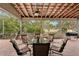 Relaxing screened patio with seating area and views of the backyard at 3011 Ashton Rd, Sarasota, FL 34231