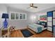 Bedroom with blue and teal bedding and wood floors at 3300 S Beneva Rd # 224, Sarasota, FL 34232