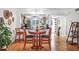 Round dining table with four chairs in a bright dining area at 3300 S Beneva Rd # 224, Sarasota, FL 34232