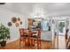 Small dining area with round table and four chairs, near kitchen at 3300 S Beneva Rd # 224, Sarasota, FL 34232