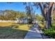 Building exterior with a walkway leading to a gated community at 3300 S Beneva Rd # 224, Sarasota, FL 34232