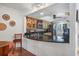 Kitchen with light wood cabinets and black countertops at 3300 S Beneva Rd # 224, Sarasota, FL 34232