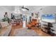 Living room, hardwood floors, and view of kitchen at 3300 S Beneva Rd # 224, Sarasota, FL 34232