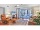 Living room with hardwood floors and access to balcony at 3300 S Beneva Rd # 224, Sarasota, FL 34232