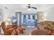 Living room with hardwood floors and access to balcony at 3300 S Beneva Rd # 224, Sarasota, FL 34232