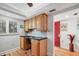 Built-in office space with wood cabinets and granite countertop at 3300 S Beneva Rd # 224, Sarasota, FL 34232