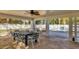 Community pool area with covered patio and table for seating at 3300 S Beneva Rd # 224, Sarasota, FL 34232