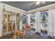 Bright screened porch with table and chairs, offering a view of the outdoors at 3300 S Beneva Rd # 224, Sarasota, FL 34232