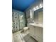Bathroom with shower/tub combo, vanity, and beachy decor at 3750 59Th W Ave # 4096, Bradenton, FL 34210