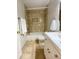 Updated bathroom with a white vanity and beige tile at 3750 59Th W Ave # 4096, Bradenton, FL 34210