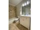 Updated bathroom with white vanity and tile shower/tub at 3750 59Th W Ave # 4096, Bradenton, FL 34210