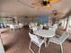 Community room with tables, chairs, and beach mural at 3750 59Th W Ave # 4096, Bradenton, FL 34210