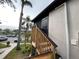 Wooden stairs leading to a condo building's rear entrance at 3750 59Th W Ave # 4096, Bradenton, FL 34210