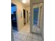 Hallway with tiled floors and mirrored closet at 3750 59Th W Ave # 4096, Bradenton, FL 34210