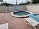 Community hot tub with lounge chairs and brick patio at 3750 59Th W Ave # 4096, Bradenton, FL 34210