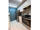 Bright kitchen features stainless steel appliances and white cabinets at 3750 59Th W Ave # 4096, Bradenton, FL 34210