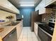 Galley kitchen with stainless steel appliances at 3750 59Th W Ave # 4096, Bradenton, FL 34210