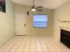 Living room with tile floors, fireplace, and window at 3750 59Th W Ave # 4096, Bradenton, FL 34210