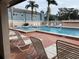 Community pool with lounge chairs and brick patio at 3750 59Th W Ave # 4096, Bradenton, FL 34210