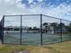 Outdoor tennis court with chain link fence at 3750 59Th W Ave # 4096, Bradenton, FL 34210