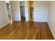 Hardwood floor bedroom with access to bathroom and closet at 3983 Maceachen Blvd # 432, Sarasota, FL 34233