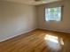 Bright bedroom with hardwood floors and a ceiling fan at 3983 Maceachen Blvd # 432, Sarasota, FL 34233