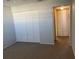 Bedroom with large closet and neutral walls at 3983 Maceachen Blvd # 432, Sarasota, FL 34233