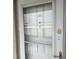 Condo building entry door with security features at 3983 Maceachen Blvd # 432, Sarasota, FL 34233