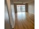 Spacious living room with wood flooring and access to balcony at 3983 Maceachen Blvd # 432, Sarasota, FL 34233