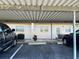 Covered parking area with assigned spots and ample space for vehicles at 3983 Maceachen Blvd # 432, Sarasota, FL 34233