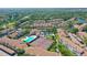 Aerial view of community with pool and tennis courts at 4275 Castlebridge Ln # 1312B1, Sarasota, FL 34238