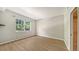 Bright bedroom with wood-look floors and large window at 4275 Castlebridge Ln # 1312B1, Sarasota, FL 34238