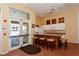 Community kitchen with bar seating and modern appliances at 4275 Castlebridge Ln # 1312B1, Sarasota, FL 34238